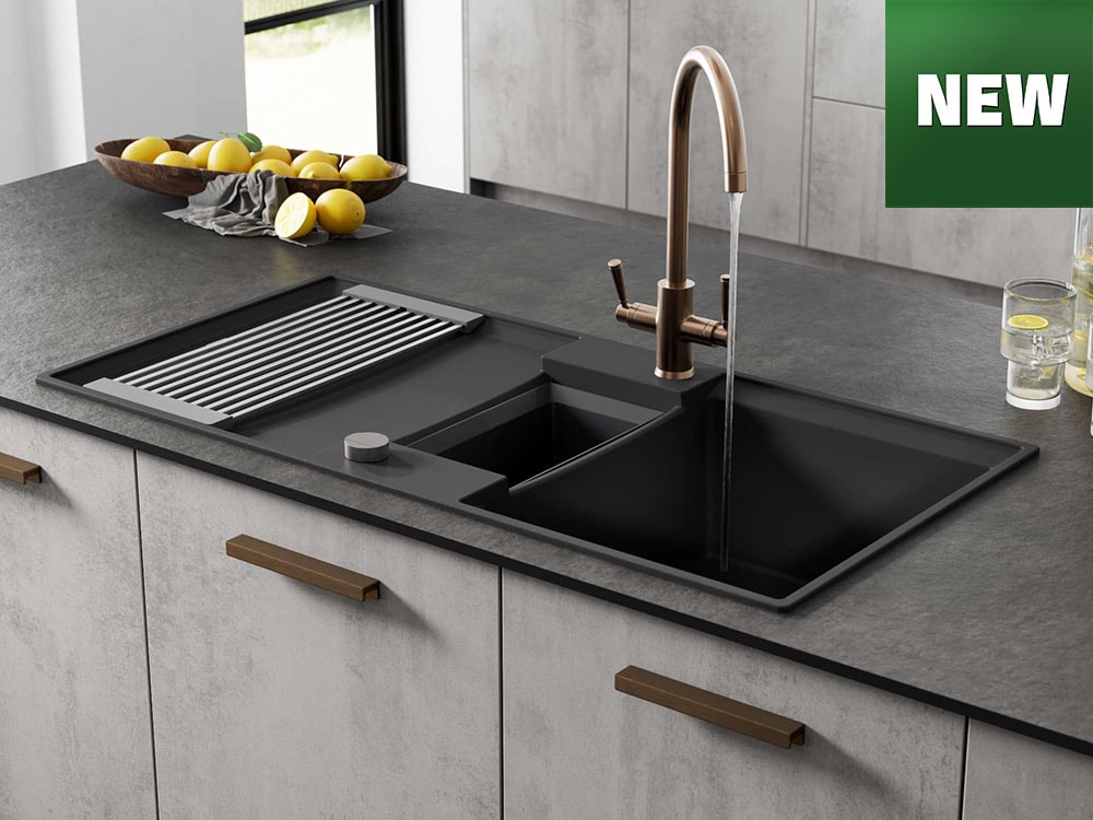 A new logo showing on a marble kitchen worktop in an open plan kitchen with black tap and composite sink