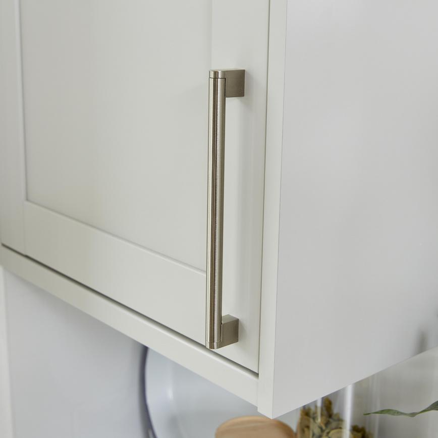 Bickern Brushed Nickel Cupboard Handle vertically mounted on a wall cabinet
