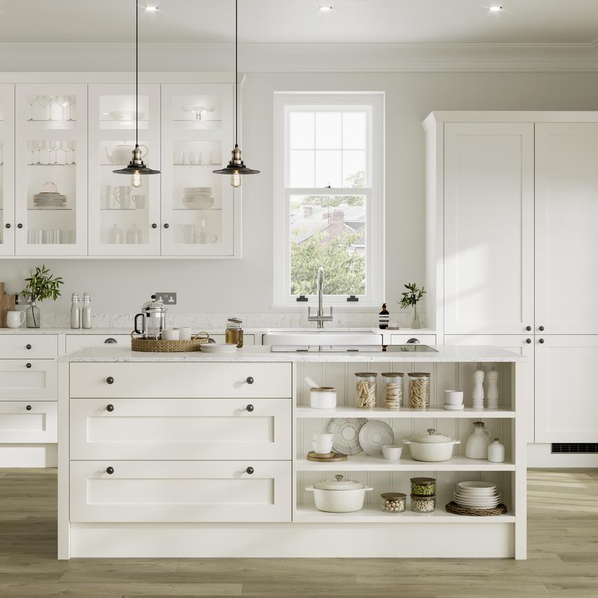 White shaker kitchen idea with island in open-plan layout. Has open shelving, clear glass wall units, and black knob handles.