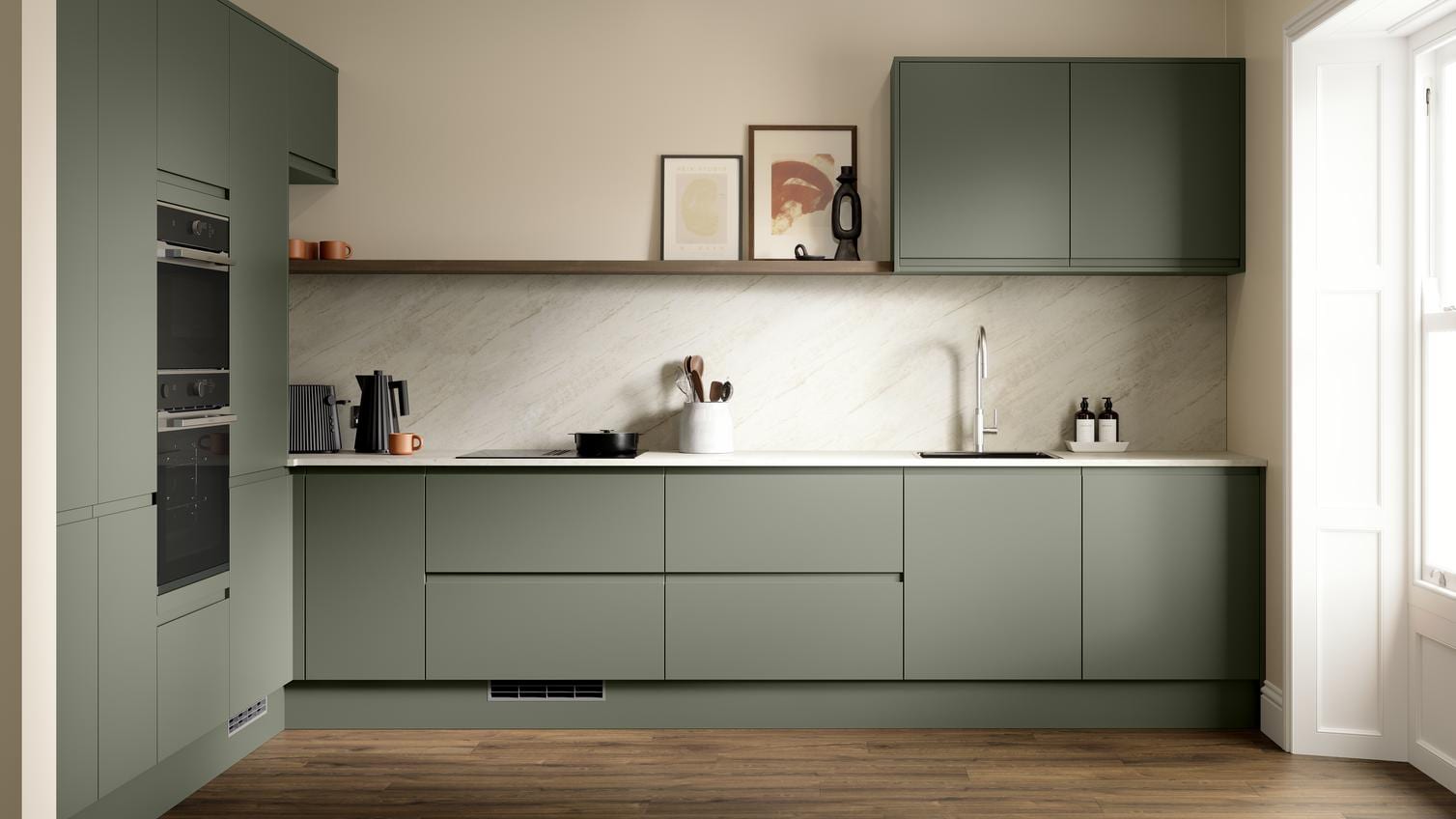 A modern dark ash green kitchen with integrated handles. It is in an l-shape layout with white stone worktops and back panel.