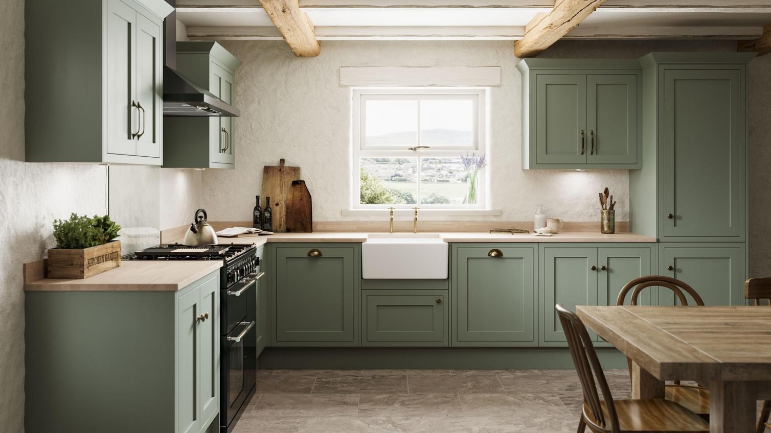 A reed green shaker kitchen from Ilfracombe, in an l-shaped layout. It has wall cabinets, stone flooring, and wood worktops.