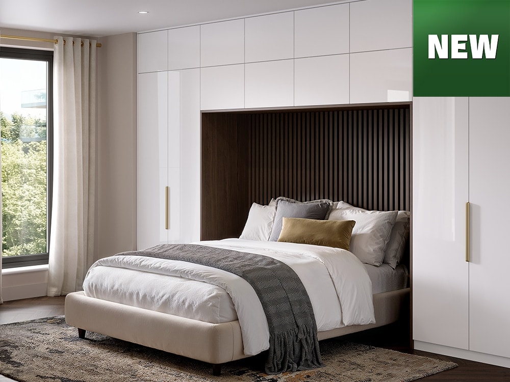 Bedroom with white wardrobe cupboards and new logo