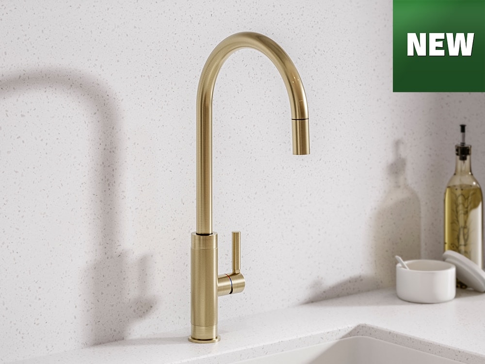 Brushed gold kitchen tap over white sink with new logo