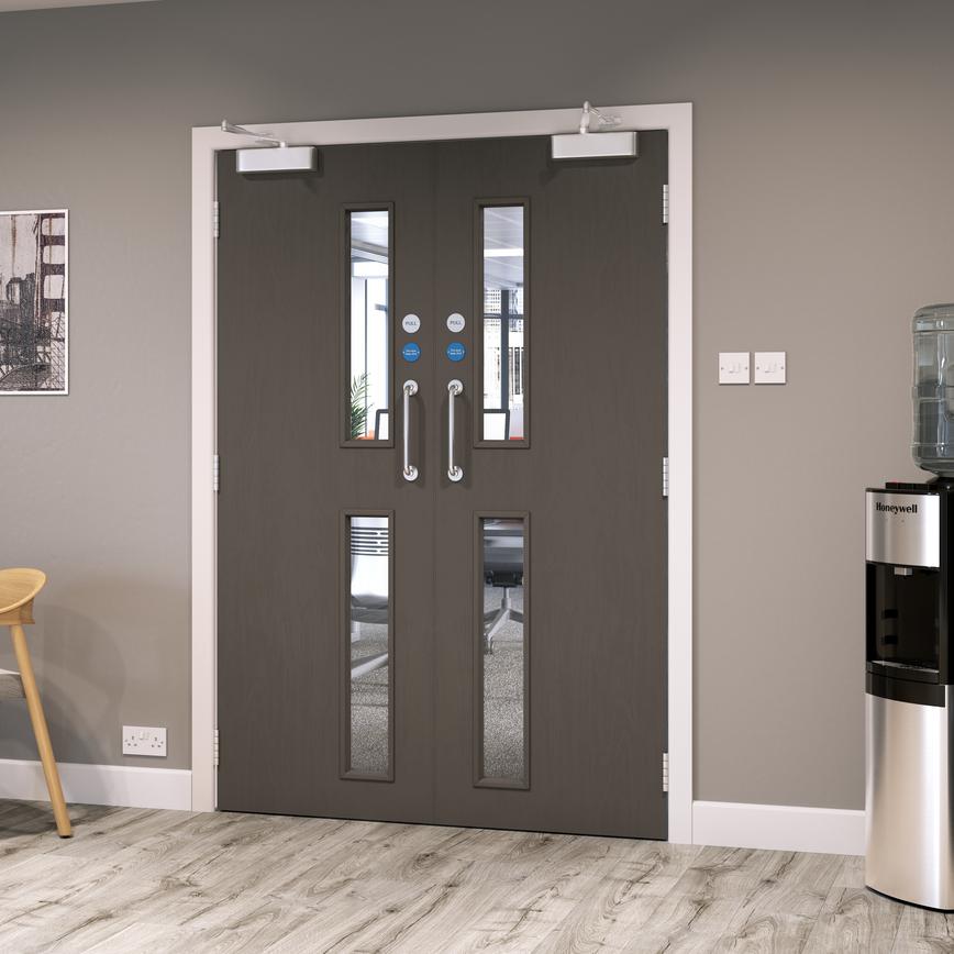 Spey Ply 16G glazed FD30 door in an office