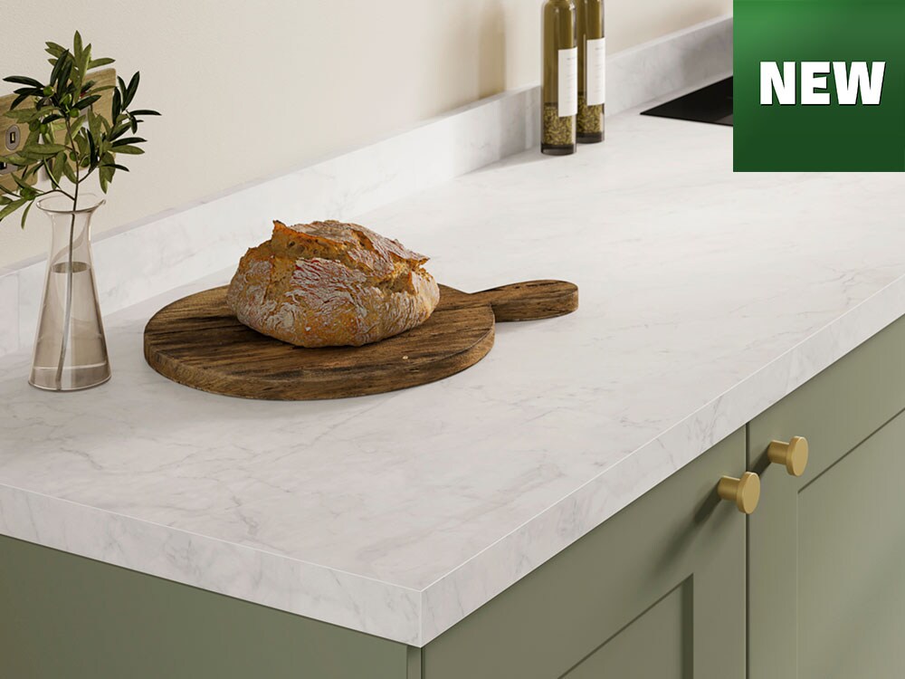 Smooth new kitchen worktop in a light stone finish with minimalist styling.